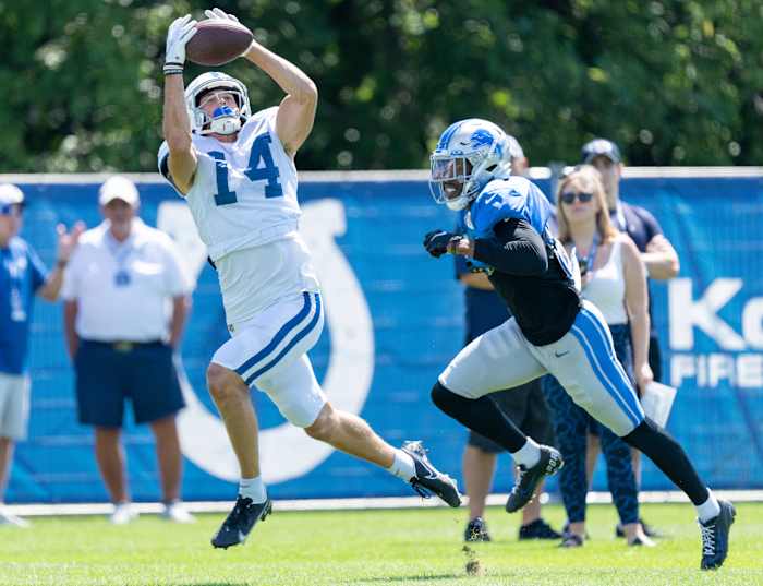 Indianapolis Colts wide receiver Alec Pierce (14) jumps for a reception as he works against a Detroit Lions defender during training camp Wednesday, Aug. 17, 2022, at Grand Park in Westfield, Ind.